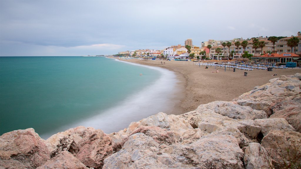 La Carihuela which includes a sandy beach and general coastal views