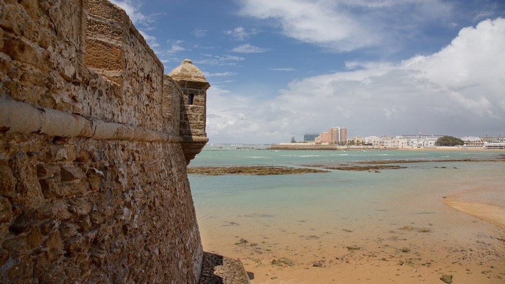 Fortress of San Sebastian showing a beach and a castle