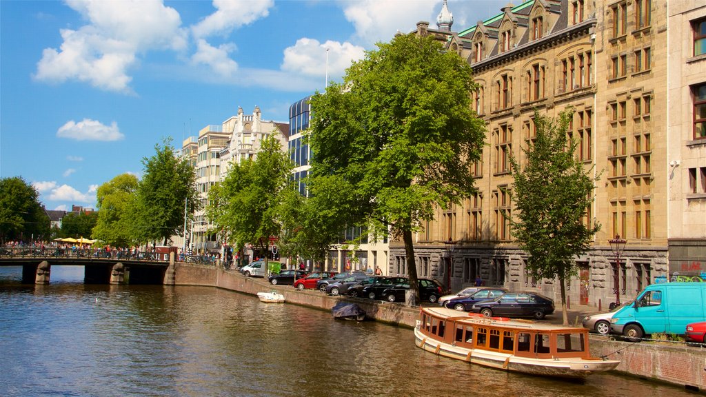 North Holland showing boating, a small town or village and a river or creek