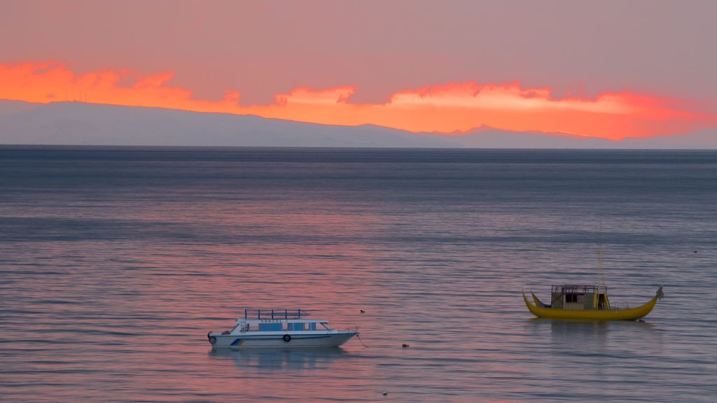 Copacabana showing general coastal views, a sunset and boating