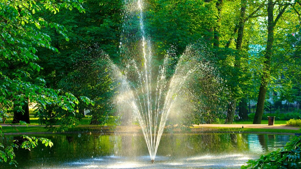 Palace Park featuring a garden, a fountain and a pond