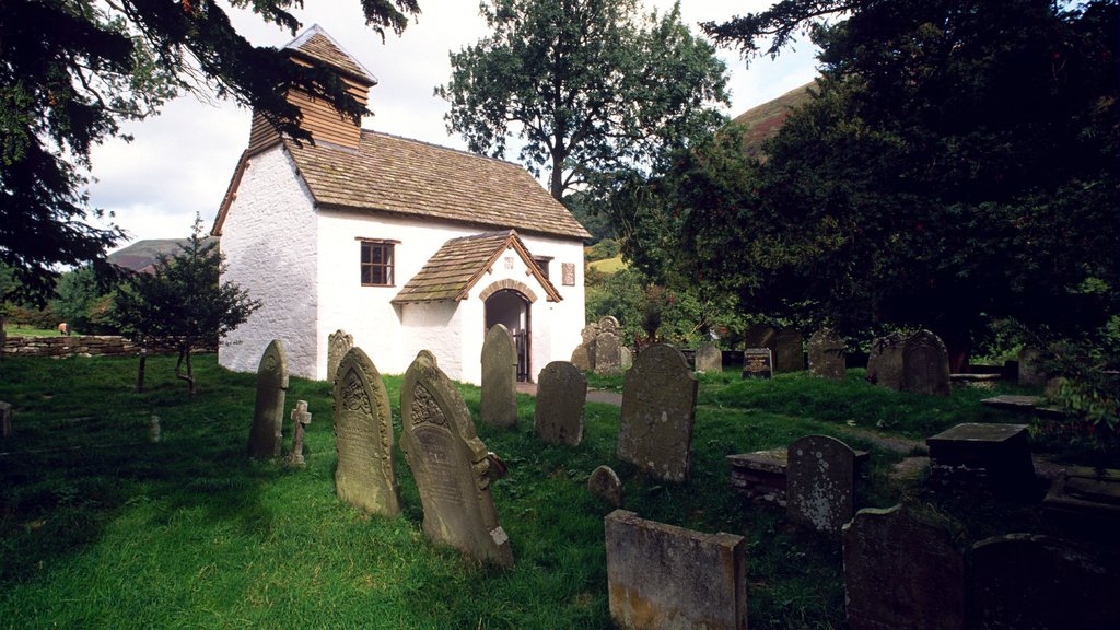 Powys featuring a cemetery and a house