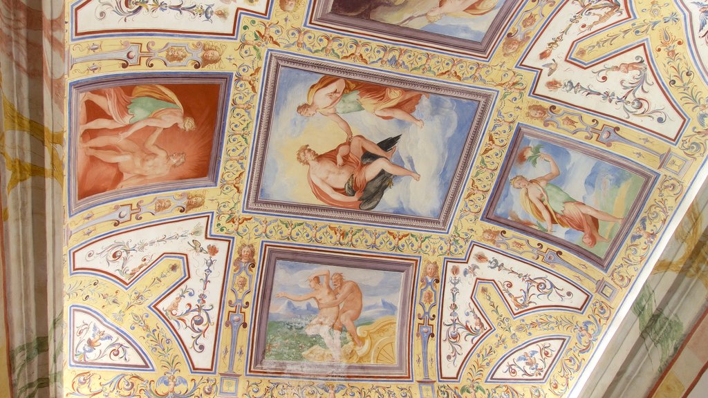 Castiglione del Lago caracterizando arte, elementos religiosos e um pequeno castelo ou palácio