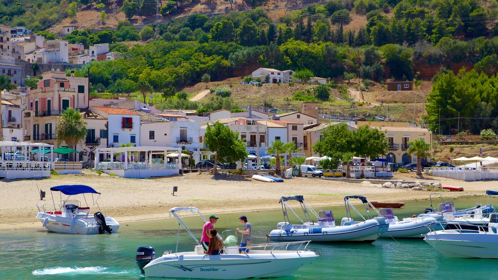 Castellammare del Golfo which includes a sandy beach, a coastal town and boating