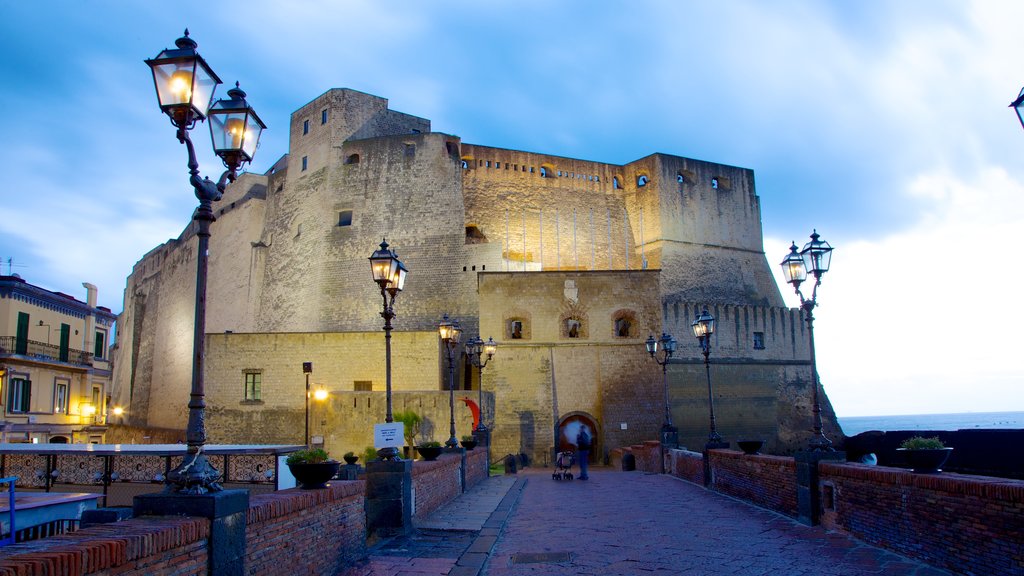 Castel dell\'Ovo which includes chateau or palace, night scenes and heritage elements