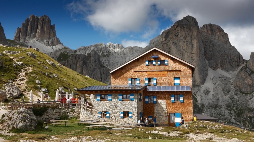 Fassa Valley showing mountains, tranquil scenes and a house