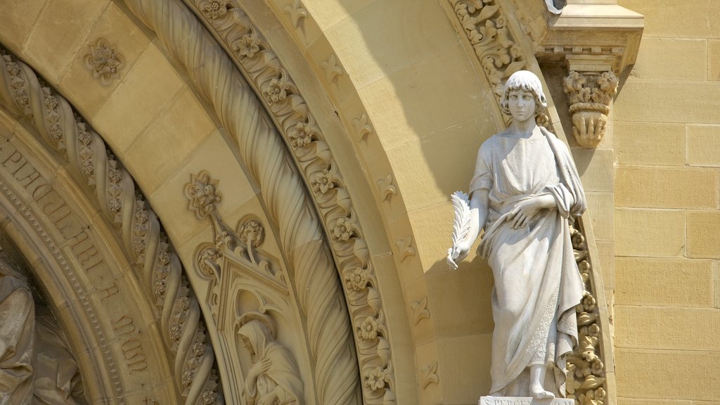 Cathedral of Arezzo featuring a church or cathedral, a statue or sculpture and religious aspects