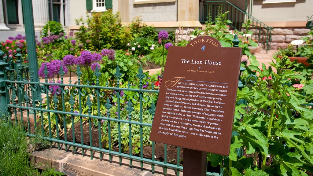 Lion House featuring flowers and signage