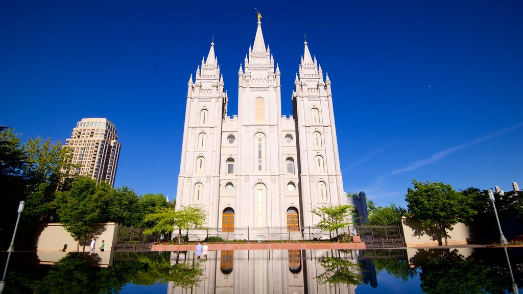 Salt Lake Temple featuring a church or cathedral, heritage architecture and a lake or waterhole