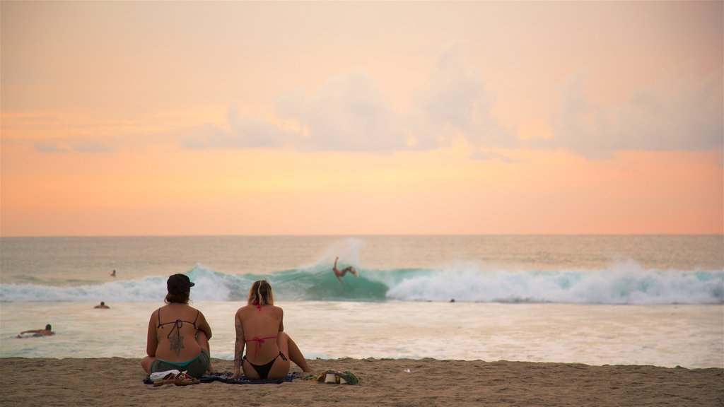 Zicatela Beach which includes a sunset, a beach and surf