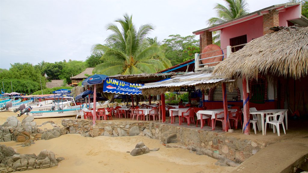 Praia Puerto Angelito mostrando cenas tropicais, paisagens litorâneas e uma praia