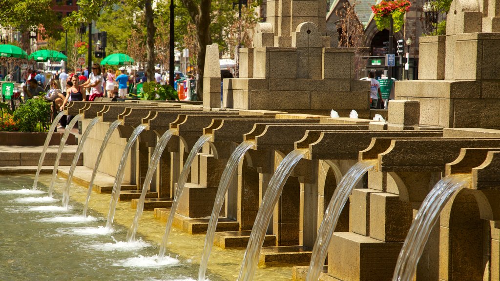 Copley Square featuring a fountain, a pond and a city