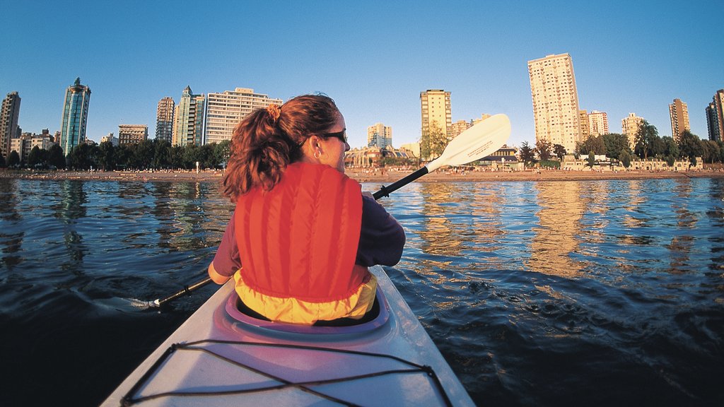 English Bay showing a bay or harbour, kayaking or canoeing and a skyscraper