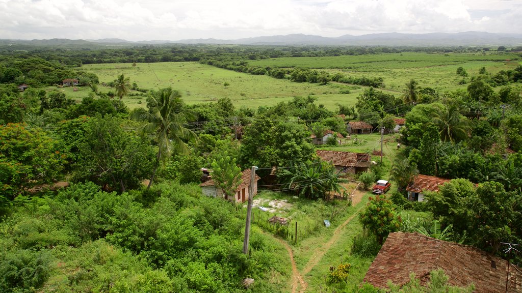 Manaca Iznaga which includes tranquil scenes and a small town or village