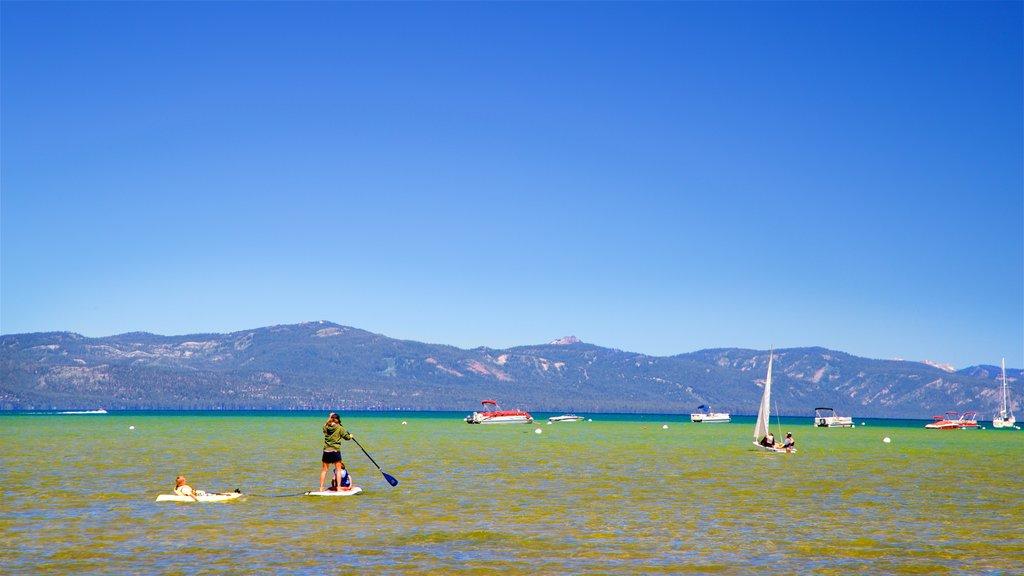 South Lake Tahoe yang mencakup kayak atau kano, suasana damai dan pemandangan umum pantai