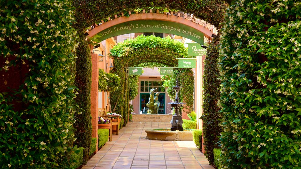 Sonoma Plaza featuring a fountain, a garden and signage