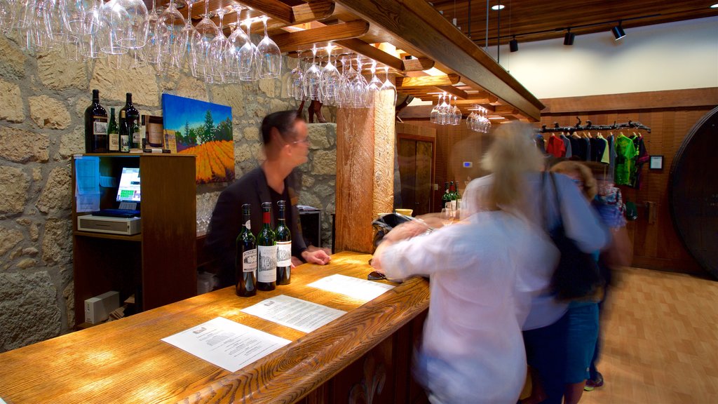 Chateau Montelena Winery showing a bar and interior views as well as a small group of people