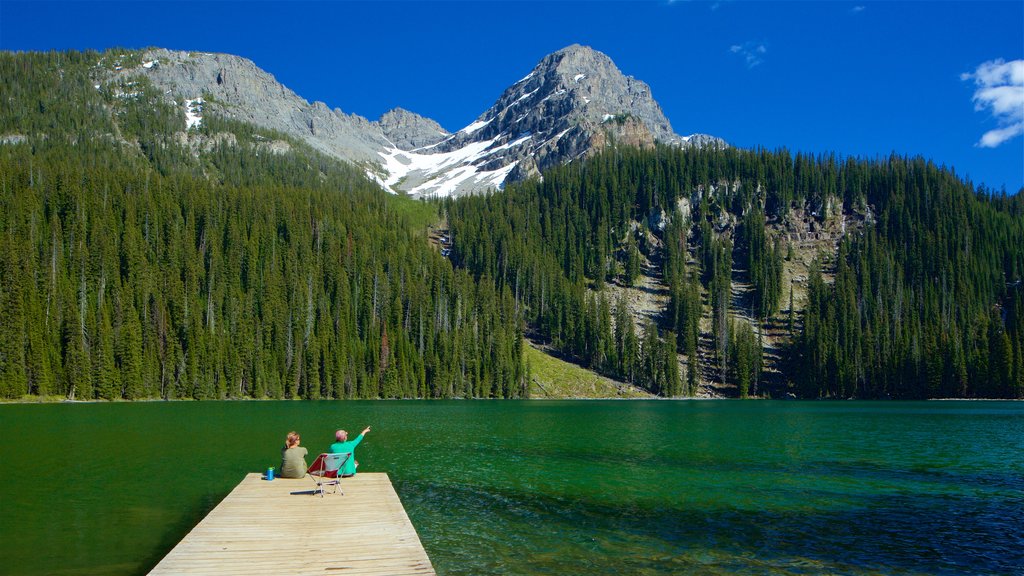 Top of the World Provincial Park showing a lake or waterhole and tranquil scenes as well as a couple