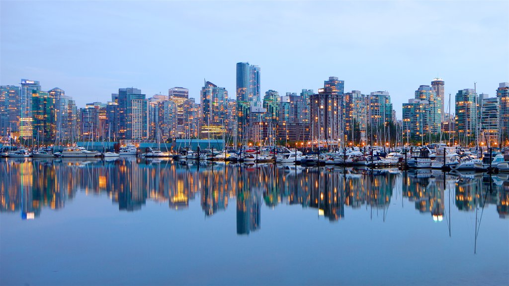 Stanley Park which includes a high-rise building, a bay or harbour and a city