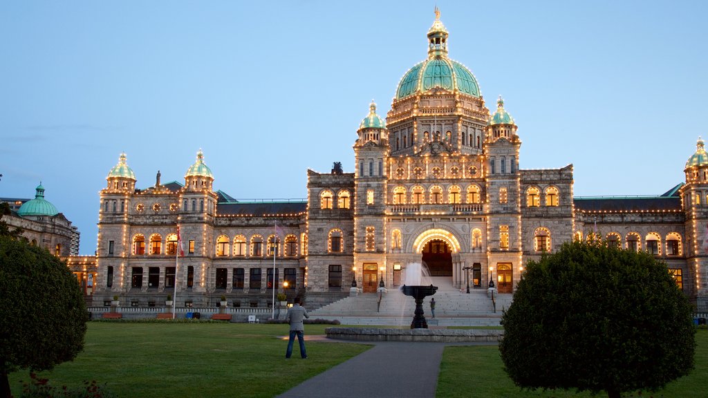 British Columbia Parliament Building showing a fountain, night scenes and a garden