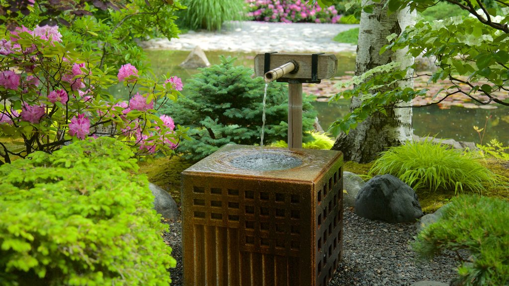 Kasugai Gardens showing wild flowers, a pond and a garden