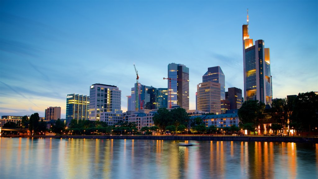 Frankfurt which includes a skyscraper, a sunset and a river or creek