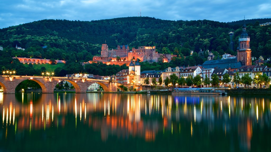 Karl Theodor Bridge which includes night scenes, a city and a bridge