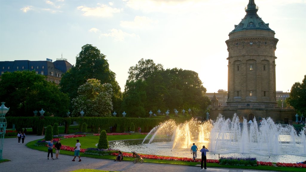 Mannheim Water Tower showing a garden, heritage architecture and a sunset