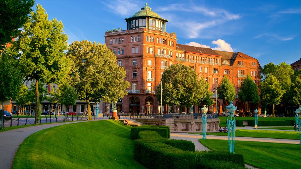 Friedrichsplatz featuring a garden, heritage elements and a sunset