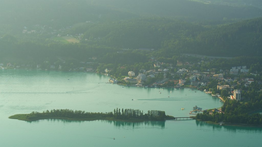 Keutschach am See showing a small town or village, a sunset and a lake or waterhole