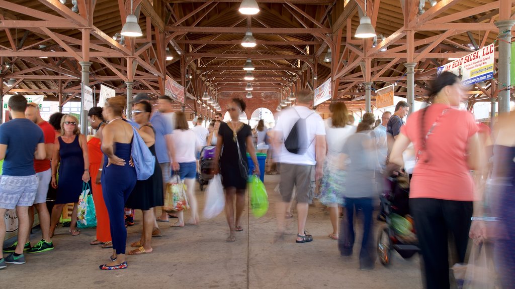 Eastern Market featuring interior views as well as a large group of people