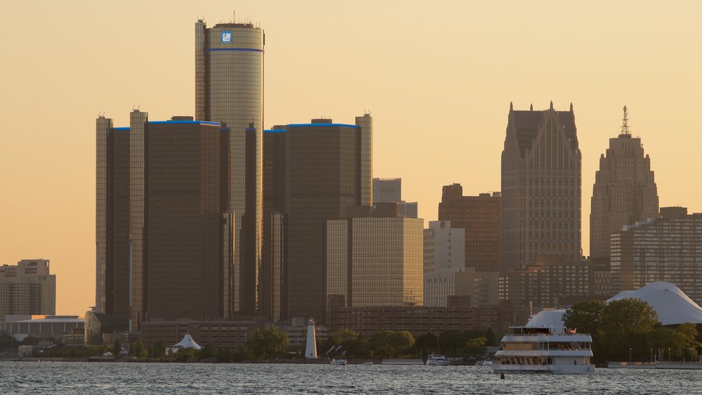 Belle Isle which includes a high rise building, a sunset and a lake or waterhole