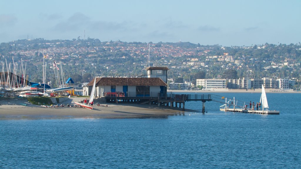 Mission Beach showing a bay or harbour, a marina and a beach