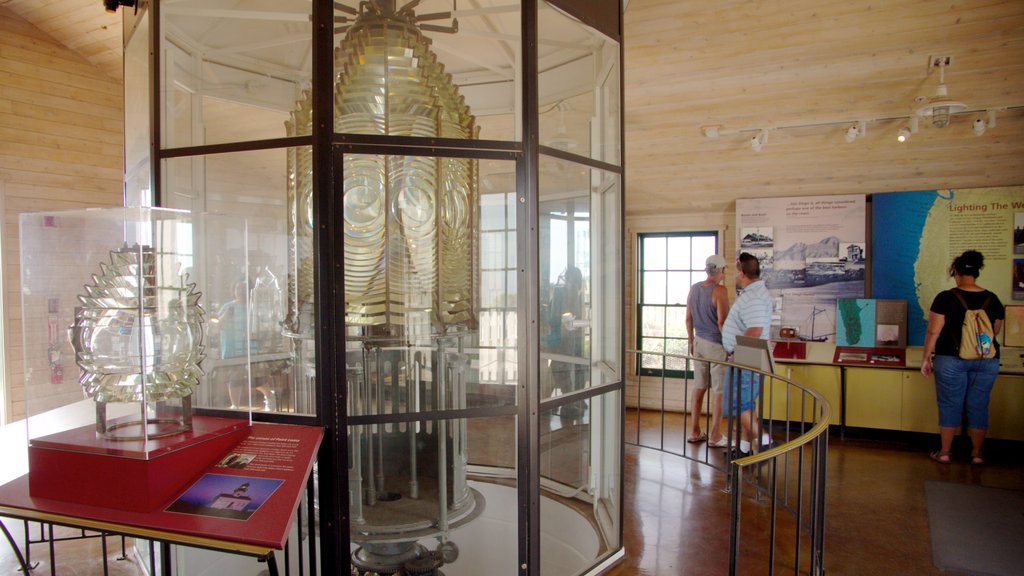 Cabrillo National Monument showing interior views and a monument as well as a small group of people