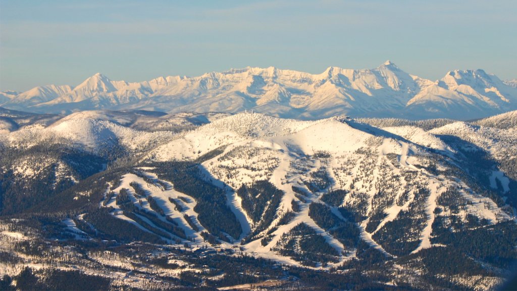 Whitefish Mountain Ski Resort which includes mountains, snow and a sunset