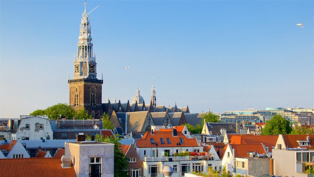 Ámsterdam mostrando elementos del patrimonio, una puesta de sol y una ciudad