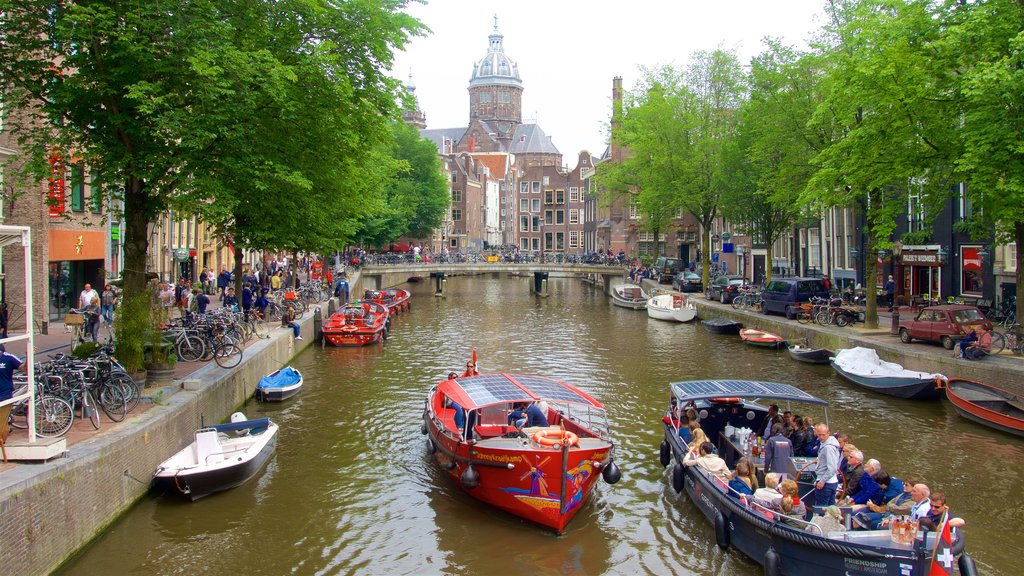 Canal Ring featuring a ferry and a park as well as a small group of people