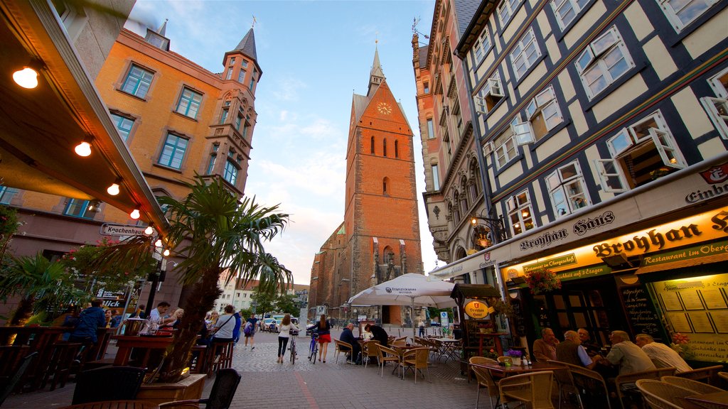 Marktkirche showing outdoor eating and heritage elements as well as a small group of people