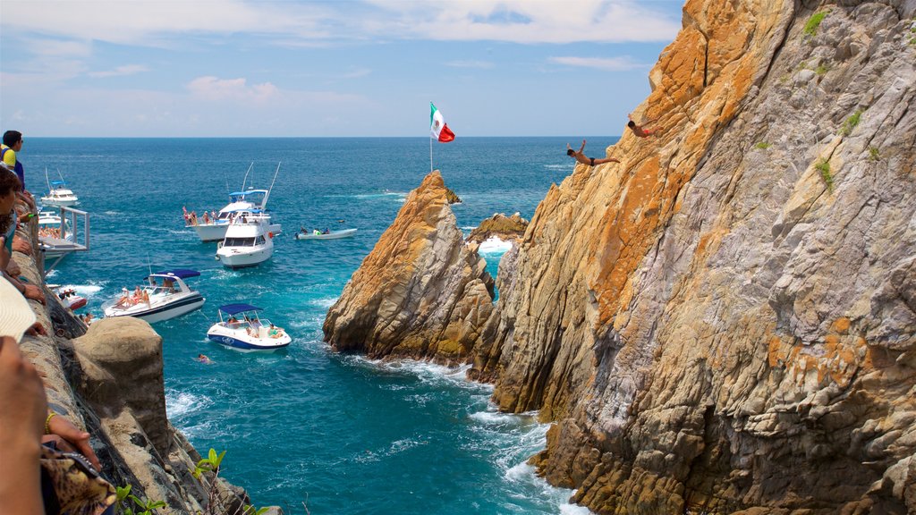 La Quebrada Cliffs showing rocky coastline and boating