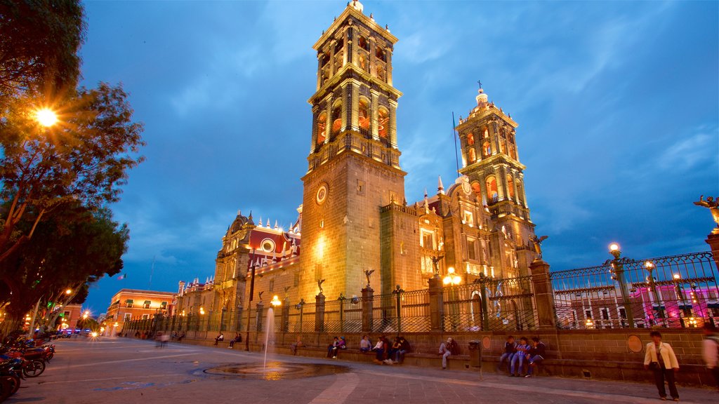 Puebla Cathedral which includes a church or cathedral, heritage architecture and night scenes