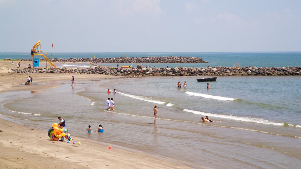 Mocambo Beach which includes general coastal views, a sandy beach and swimming