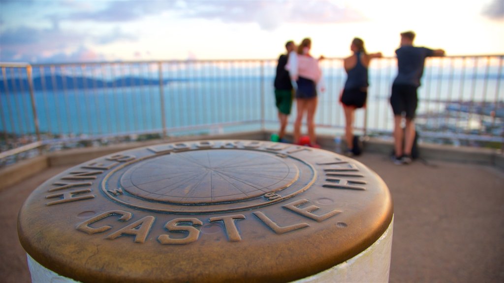 Castle Hill showing general coastal views and views as well as a small group of people