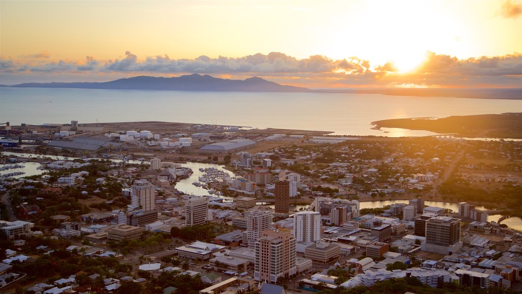 Castle Hill showing a city, a sunset and landscape views