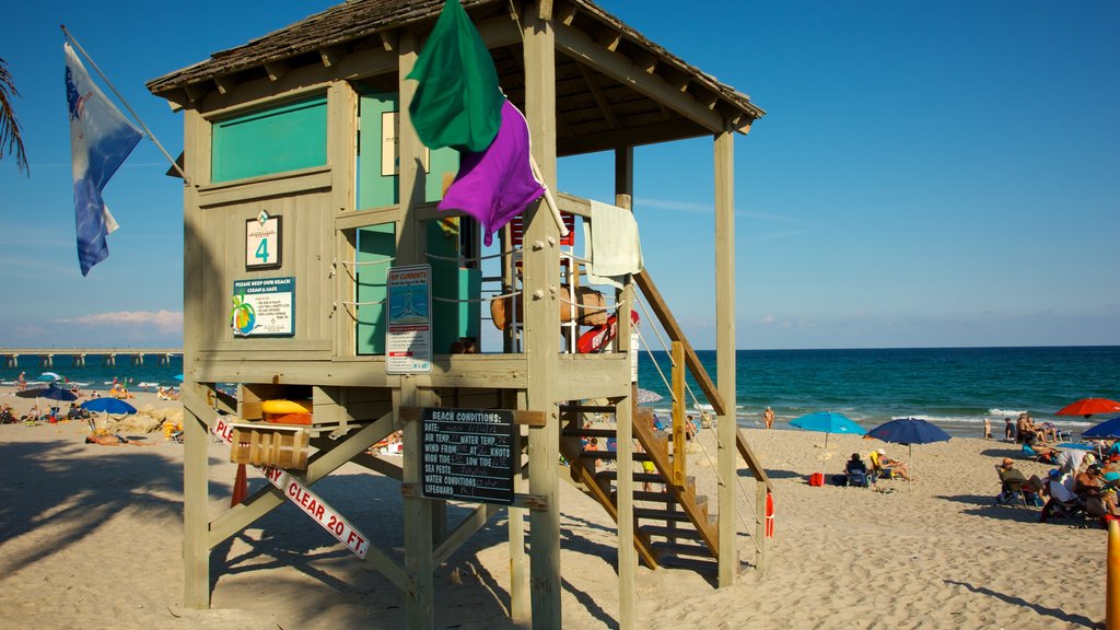 Deerfield Beach Pier featuring a sandy beach and landscape views