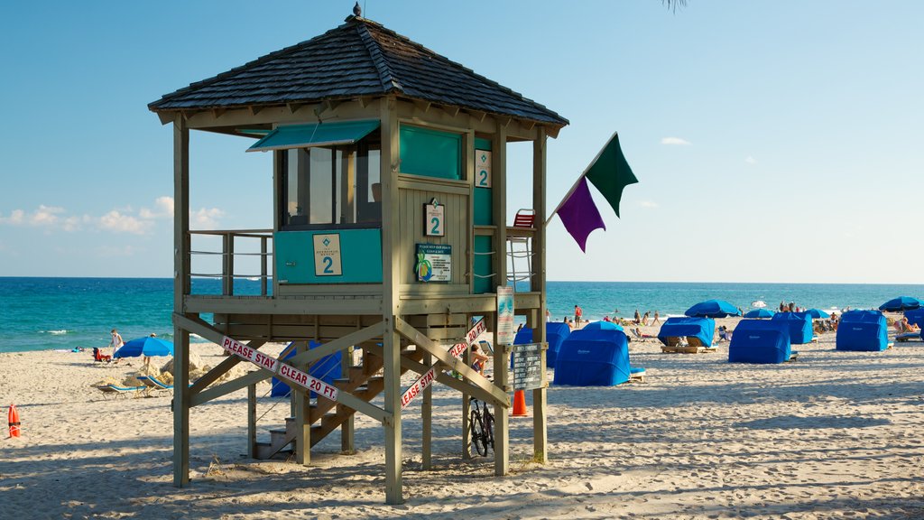 Deerfield Beach Pier which includes a beach and a coastal town