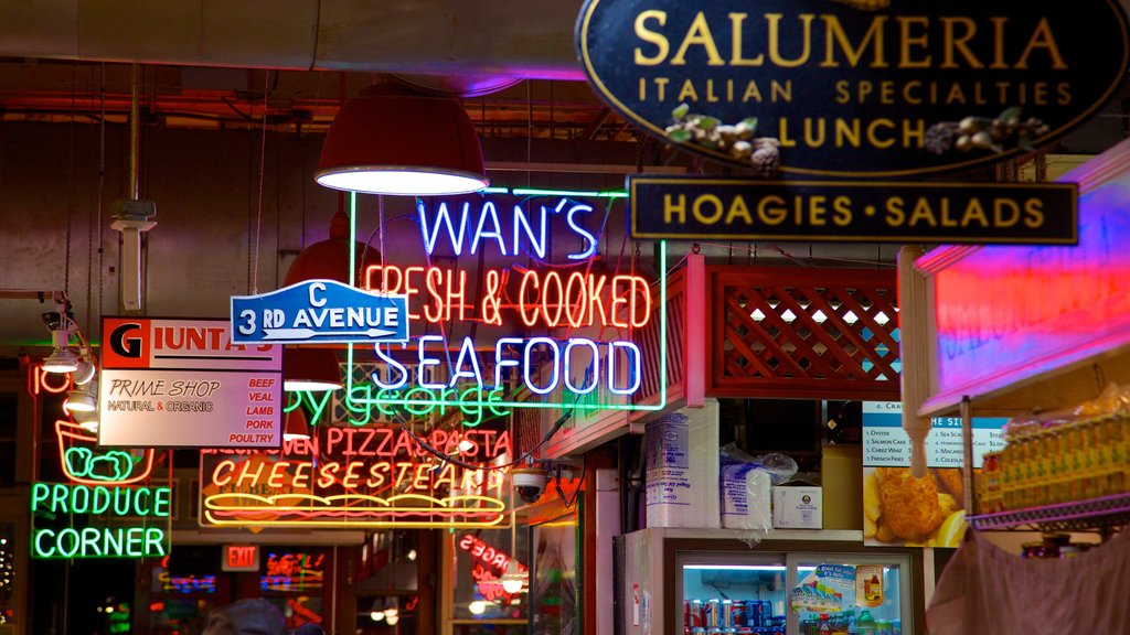 Reading Terminal Market which includes markets, signage and night scenes