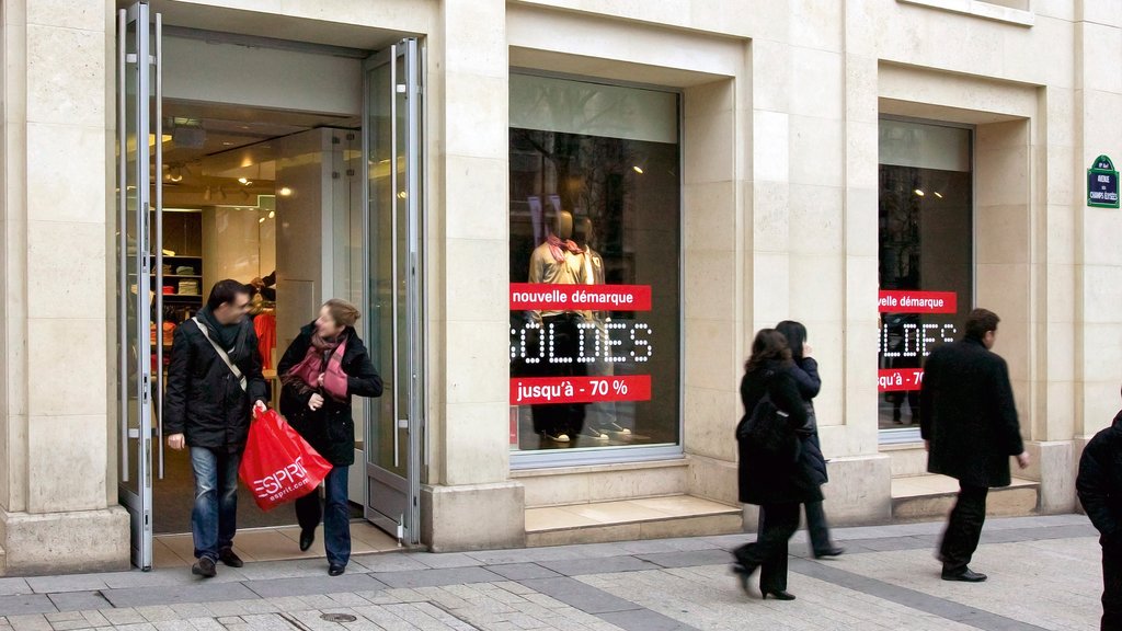 Champs Elysees showing shopping, a city and street scenes