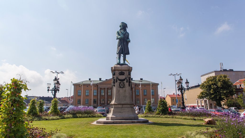 Karlskrona showing wild flowers, a statue or sculpture and a garden