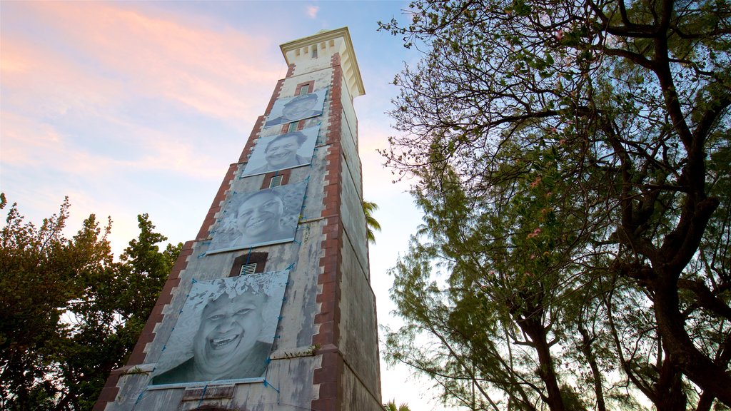 Pointe Venus Lighthouse featuring a sunset and a monument