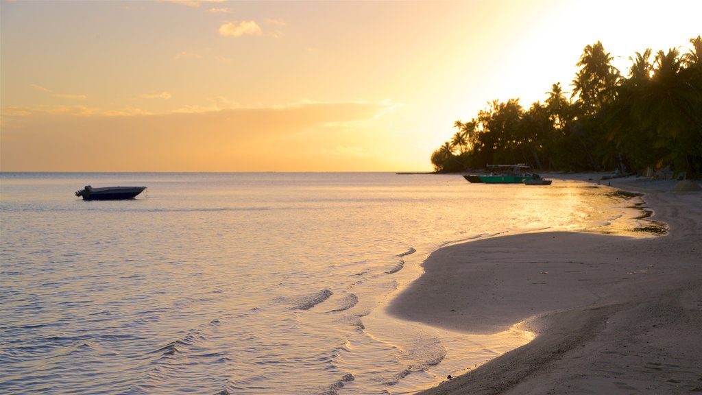 Matira Beach showing a sunset, a beach and general coastal views